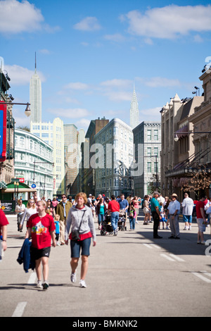 Park guests walk on streets of New York Street back lot set at Disney's Hollywood Studios Stock Photo