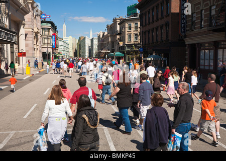 Park guests walk on streets of New York Street back lot set at Disney's Hollywood Studios Stock Photo