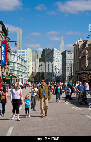 Park guests walk on streets of New York Street back lot set at Disney's Hollywood Studios Stock Photo