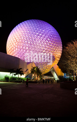 Geodesic dome of Spaceship Earth attraction lit with purple lights at night in Walt Disney's Epcot Center Stock Photo