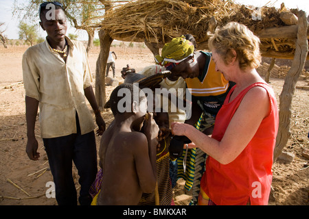 Mali, Youga. Tourist showing photos to the locals, Stock Photo