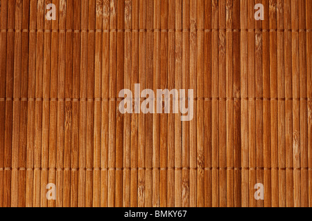 natural bamboo slatted mat background in brown tones Stock Photo