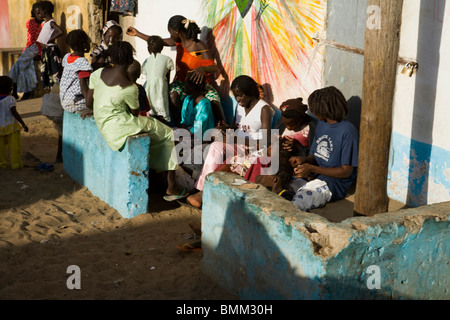 Senegal, Saint-Louis. People sitting in front of their house in Guet N'Dar Stock Photo