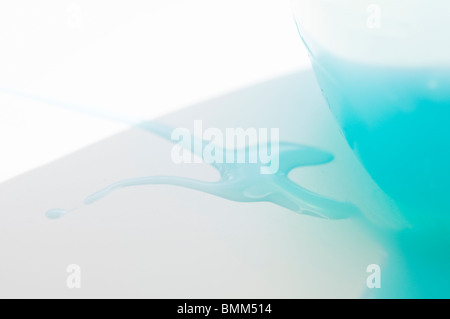 Clothes Washing Liquid that has spilled out of a plastic container. Stock Photo