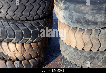 Piles of used front loader tyres Stock Photo