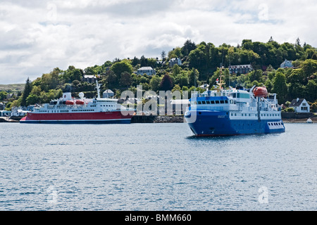 Cruise ships Expedition (left) and Quest (right) lying in Oban harbour Lorn Scotland Stock Photo