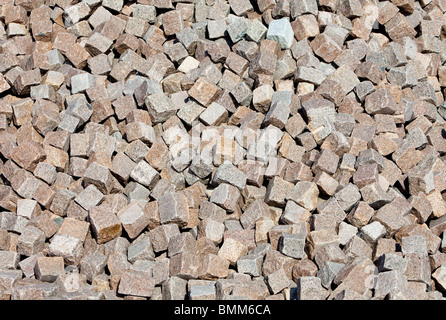 Pile of red granite cobblestones Stock Photo