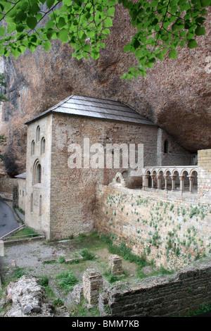 San Juan de la Pena Monastery, set into the overhanging rock, Aragonese Pyrenees, Spain Stock Photo