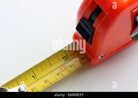 A tape measure showing a length of around 2 inches Stock Photo