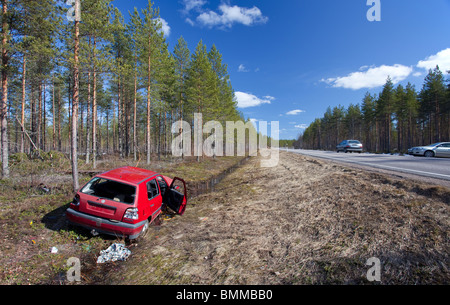 Crashed VW Volkswagen Golf at roadside ditch , Finland Stock Photo