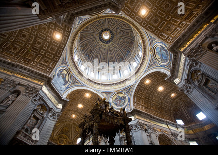 Details of the ceiling, dome and Bernini Baldacchino or Baldaquin at St Peter's Basilica or Basilica di San Pietro, Rome, Italy Stock Photo