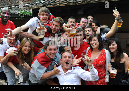 England football fans drinking beer and cheering at a pub in Brighton during the World Cup 2010 Stock Photo