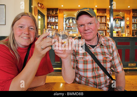 visitors at Bushmills Whiskey Distillery, Co. Antrim, Northern Ireland Stock Photo