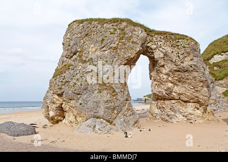 natural archway at a sandy beach near Portrush, Co. Antrim, Northern Ireland Stock Photo