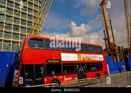 London Bus, Street, Scene England, Great Britain, Outside Construction Site at Tottenham Court Underground Station, Oxford St. Stock Photo