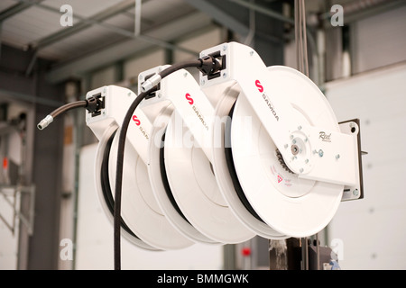 Samoa Reelmaster Waste Oil Hose Reels for use in workshop / garage Stock Photo