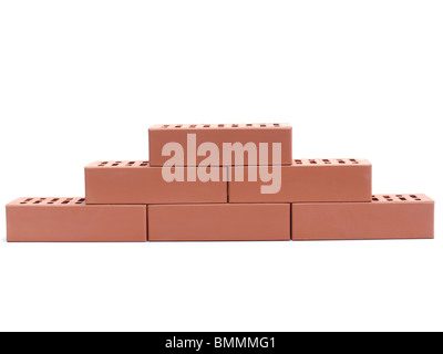 Partial wall made of perforated bricks over white background Stock Photo