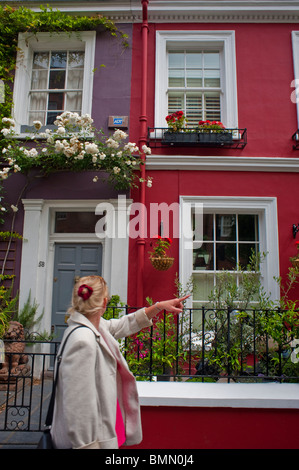 London, England, UK, Woman Walking on Street, Front of Attached Houses, Portobello Road Stock Photo
