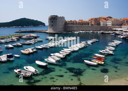 Boats in Dubrovnik Harbour with view of old town and Lokrum, Croatia, Europe Stock Photo