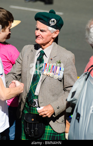 Old and young: elderly war veteran and grandson, after the ANZAC Day parade in Sydney, Australia. Stock Photo