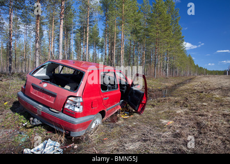 Crashed VW Volkswagen Golf at roadside ditch , Finland Stock Photo