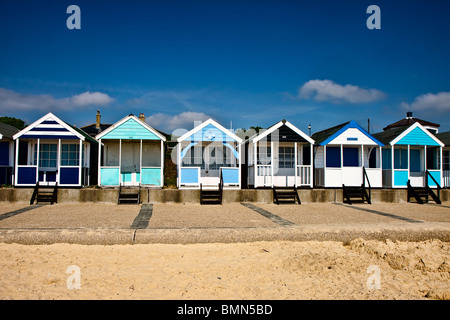 A row of brightly coloured beach huts in Southwold Suffolk Stock Photo