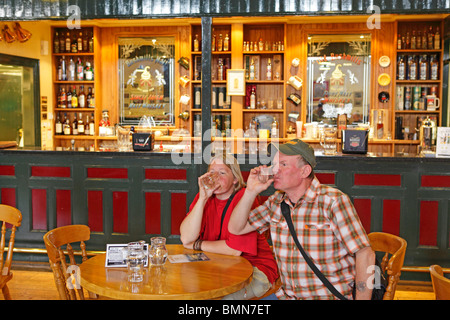 visitors at Bushmills Whiskey Distillery, Co. Antrim, Northern Ireland Stock Photo