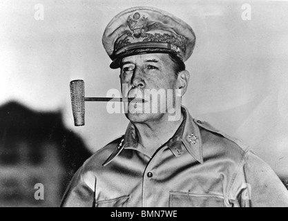 DOUGLAS MacARTHUR - US soldier (1880-1964)  with is famous corn-cob pipe about 1944 Stock Photo