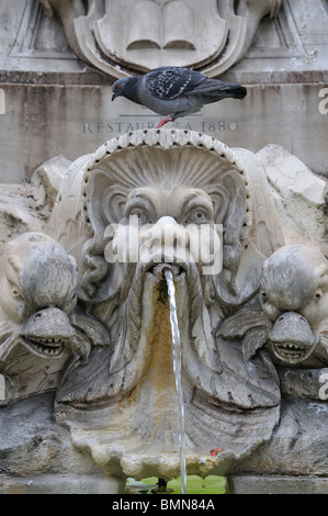 Gruesome gargoyles on the fountain of Piazza della Rotonda in fron of the Pantheon in Rome Italy. Stock Photo