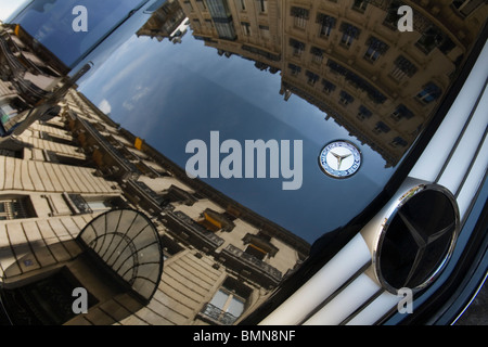 Houses Reflecting In a Mercedes Benz Black Shining Hood in Street, Paris Stock Photo