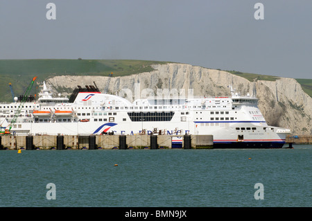 Seafrance company cross channel car passenger ferry Rodin berthed in Dover Harbour with a backdrop of the famous white cliffs UK Stock Photo