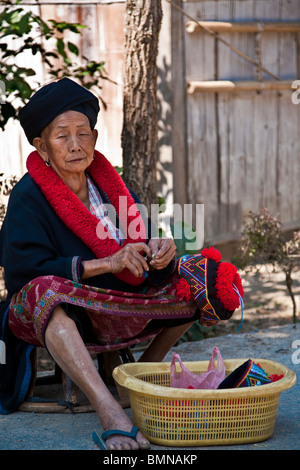 Elderly Thai lady in Traditional National Costume, Yeo/Yao, Northern Thailand. Stock Photo