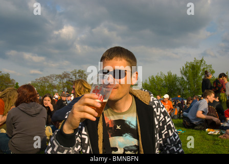 Russian man in his 30s drinking beer out of plastic cup Zizkov district Prague Czech Republic Europe Stock Photo