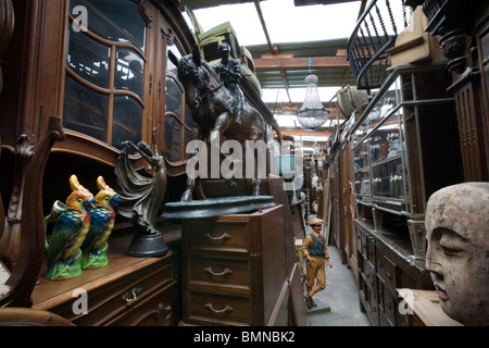 Antiques in a shop at the Marche Dauphine, Paris Stock Photo