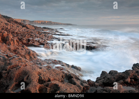 Autumn waves crash against the shores of the Glamorgan Coast in southern Wales Stock Photo