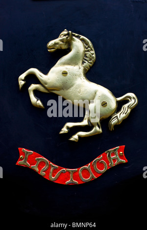 A Gold Rearing Horse Plaque on an old Steam Engine Stock Photo