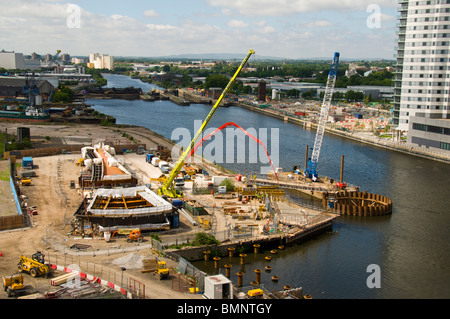 Construction work on a new swing footbridge due to go across the Manchester Ship Canal at Salford Quays, Manchester, UK Stock Photo