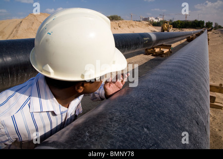 Engineer checking petrochemical oil pipeline uae Stock Photo