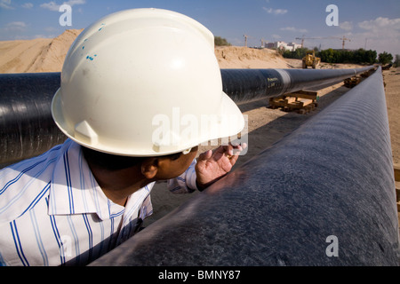 Engineer checking petrochemical oil pipeline uae Stock Photo