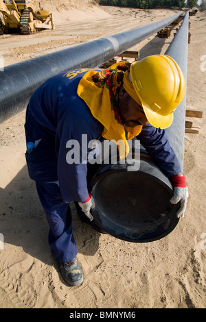 Engineer checking petrochemical oil pipeline uae Stock Photo