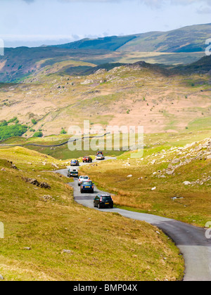 Cars driving over Hardknott Pass towards the Roman Fort in The Lake District,  Cumbria, England, UK Stock Photo