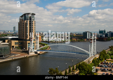 Imperial Point apartment block and the Millennium (Lowry) lifting footbridge, Salford Quays, Greater Manchester, UK Stock Photo