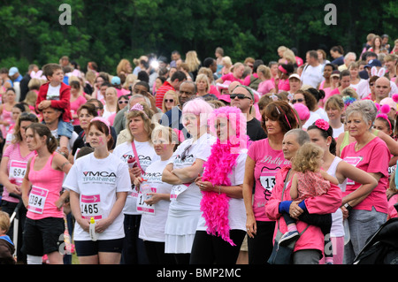 Crowd in pink at a Cancer Research UK Race for Life charity event. Stock Photo