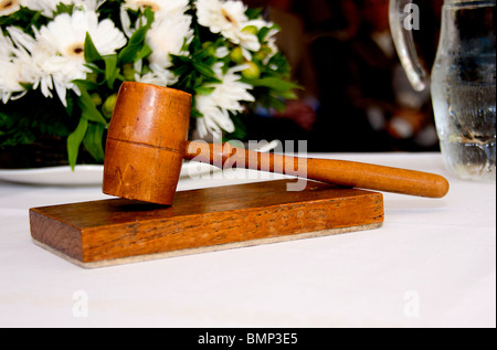 old wooden gavel in closeup used by wedding Stock Photo