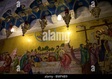 Mosaic on Wall at the entrance of Holy Sepulchre behind the Stone of Unction Stock Photo