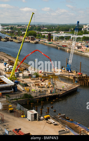 Construction work on a new swing footbridge due to go across the Manchester Ship Canal at Salford Quays, Manchester, UK Stock Photo