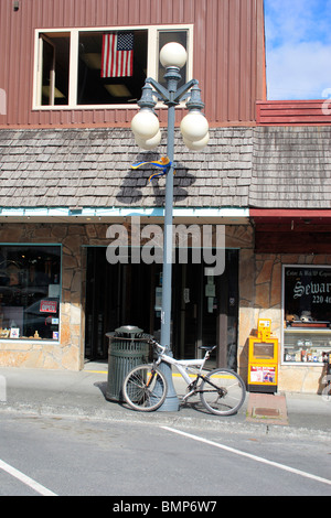 Bicycle in downtown ; Seward ; Kenai peninsula borough ;  Alaska ; U.S.A. United States of America Stock Photo