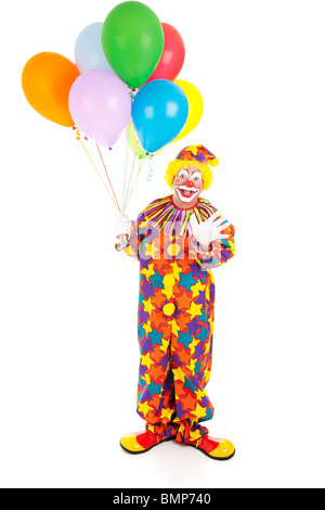 Happy birthday clown holding a bunch of balloons. Full body isolated  Stock Photo