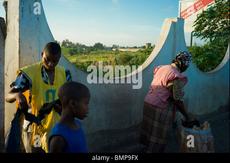 Locals waiting at a bus stop in Maputo, Mozambique, Africa. Stock Photo