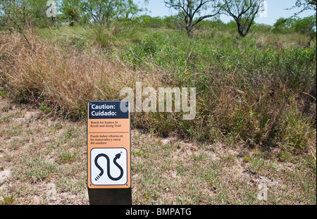Texas, Brownsville, Palo Alto Battlefield National Historic Park bilingual english spanish snake warning sign Stock Photo